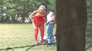 Lusty t-girl in red stockings bending down her boyfriend for outdoor anal
